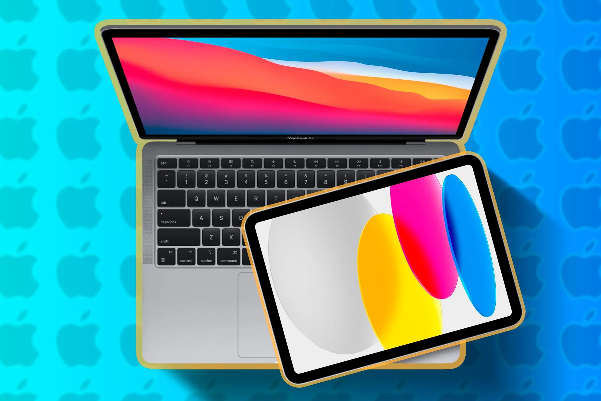 Macbook với iPad phía trên bàn phím.